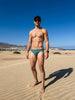 Man in a Seaman Swim brief on the dunes at Maspalomas, Gran Canaria