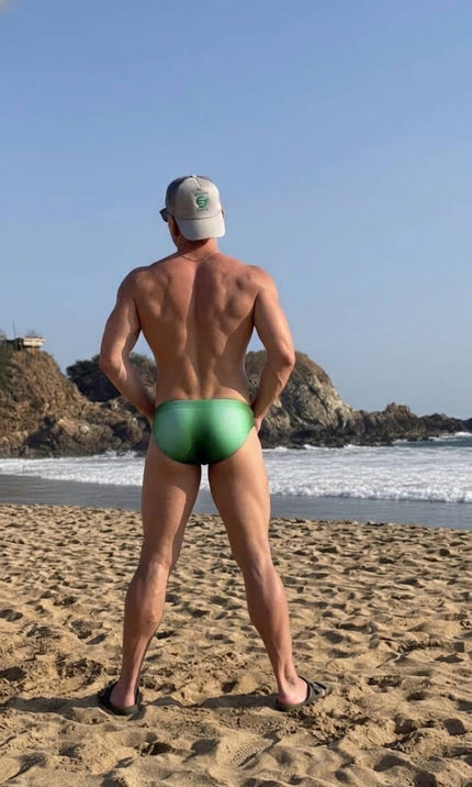 Man in a Seaman Swim brief on the sand at Zipolite, Oaxaca