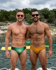 Two men on a boat at the lake wearing Seaman Swim men's swim briefs, one green and one mustard